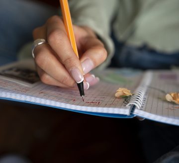 front-view-woman-doing-creative-journaling